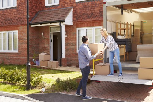 Professional house removals team working in a Fulham residential street