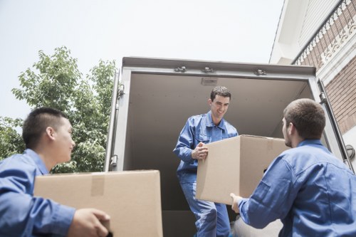 Packed office boxes and labelled assets for a Fulham business move