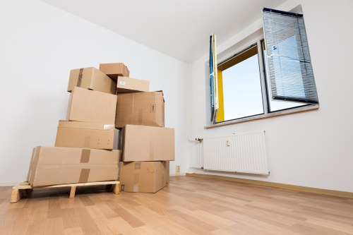 Professional movers handling furniture during a Fulham urgent relocation