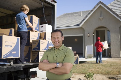 Professional office movers handling desks and equipment in Fulham